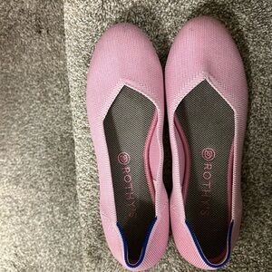 Rothy pink shoes in good condition .